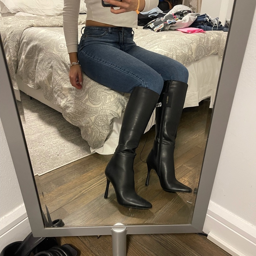 Black knee high heeled boots